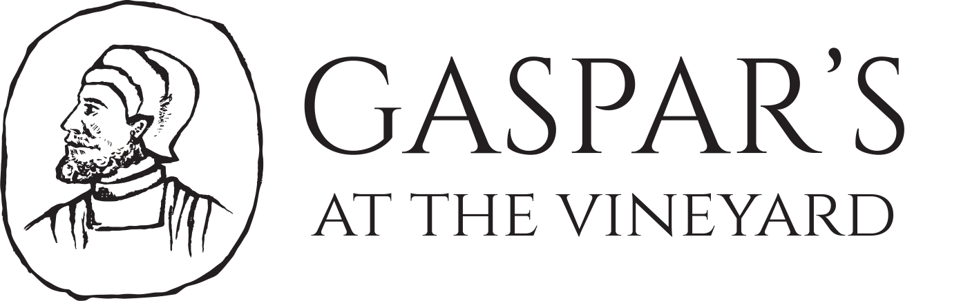 Logo of Gaspar's at the Vineyard featuring a stylized profile of a man wearing a head covering, accompanied by the words 'Gaspar's at the Vineyard' in a modern font. This image represents a dining establishment focused on Spanish food and fusion.